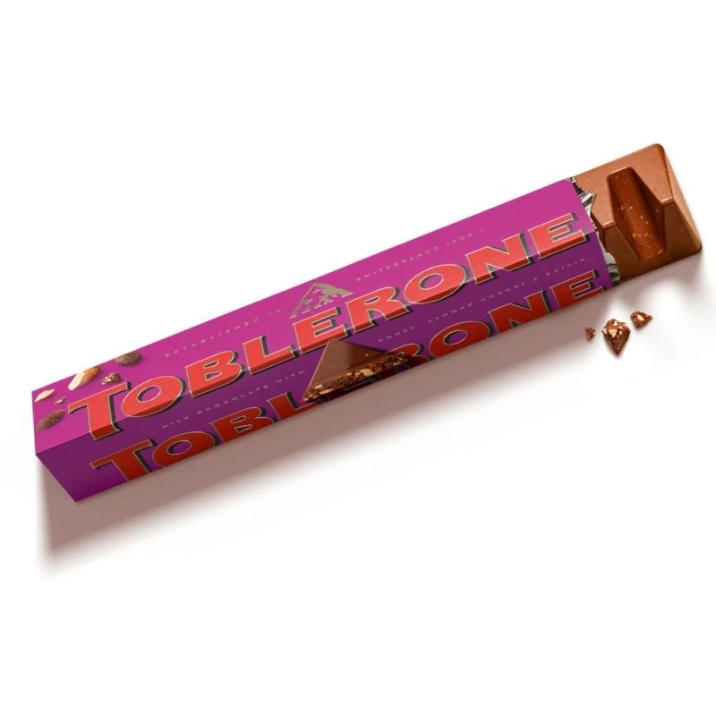 шоколад Toblerone Milk Chocolate Raisins млечен със стафиди, мед и бадемова нуга 100гр GR